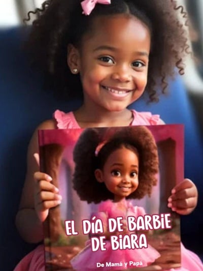 Child smiling while holding their personalized children's book from Adorabook