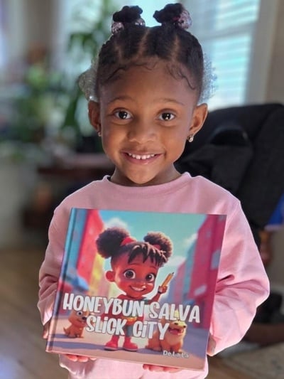Excited child holding a custom photo personalized kids book