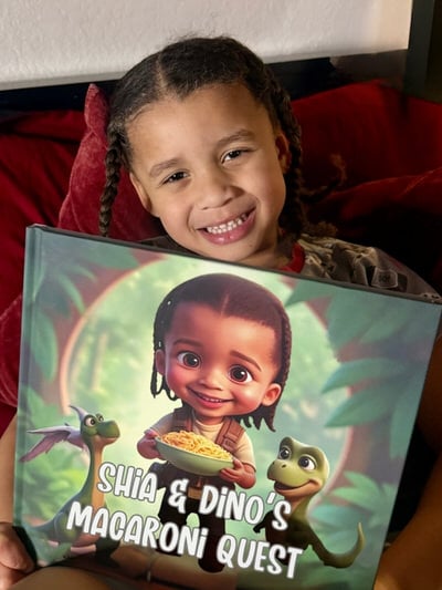 Young child happily posing with their personalized illustrated kids book