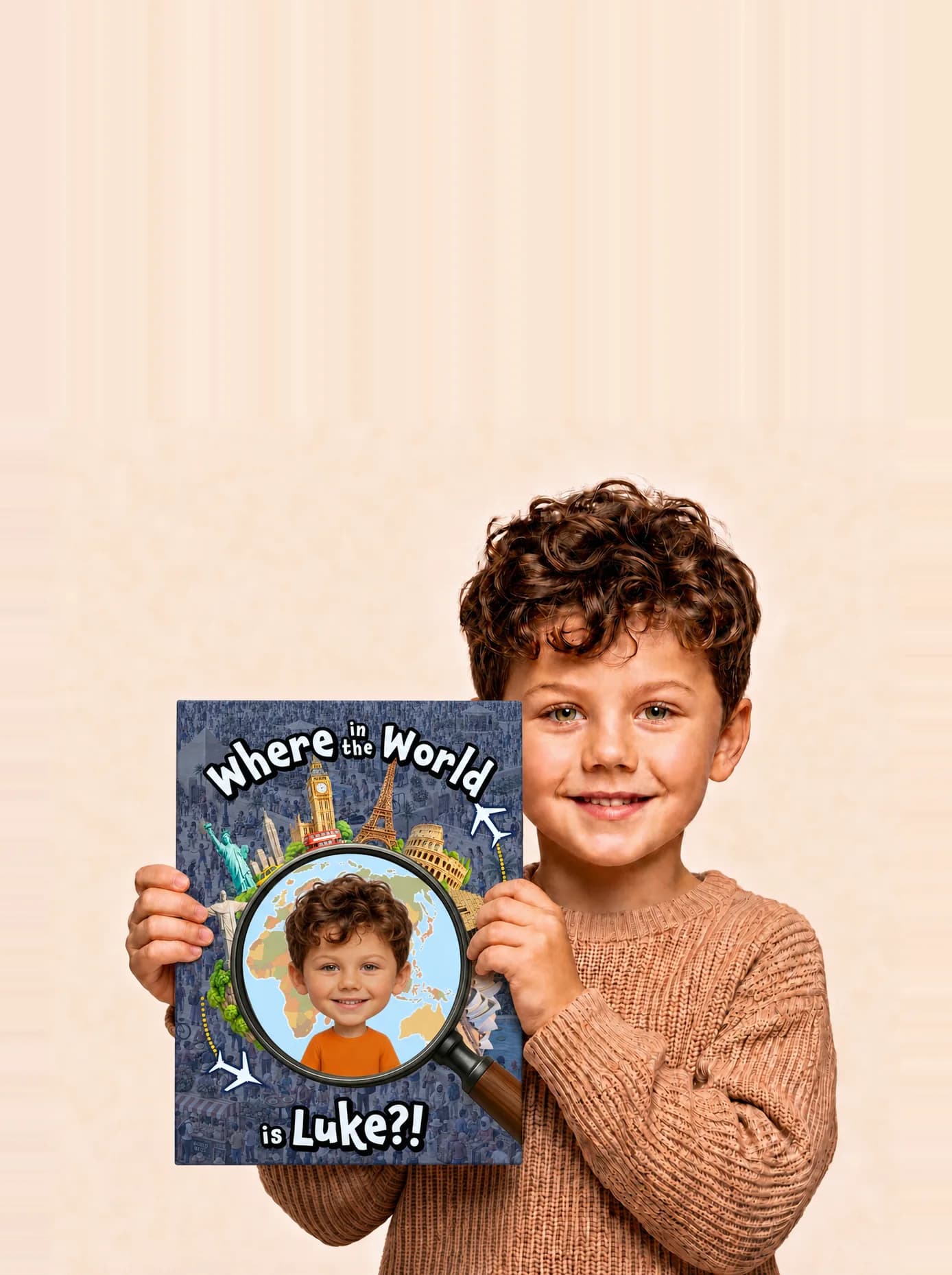 Happy boy holding his personalized Adorabook Where in the World search and find book